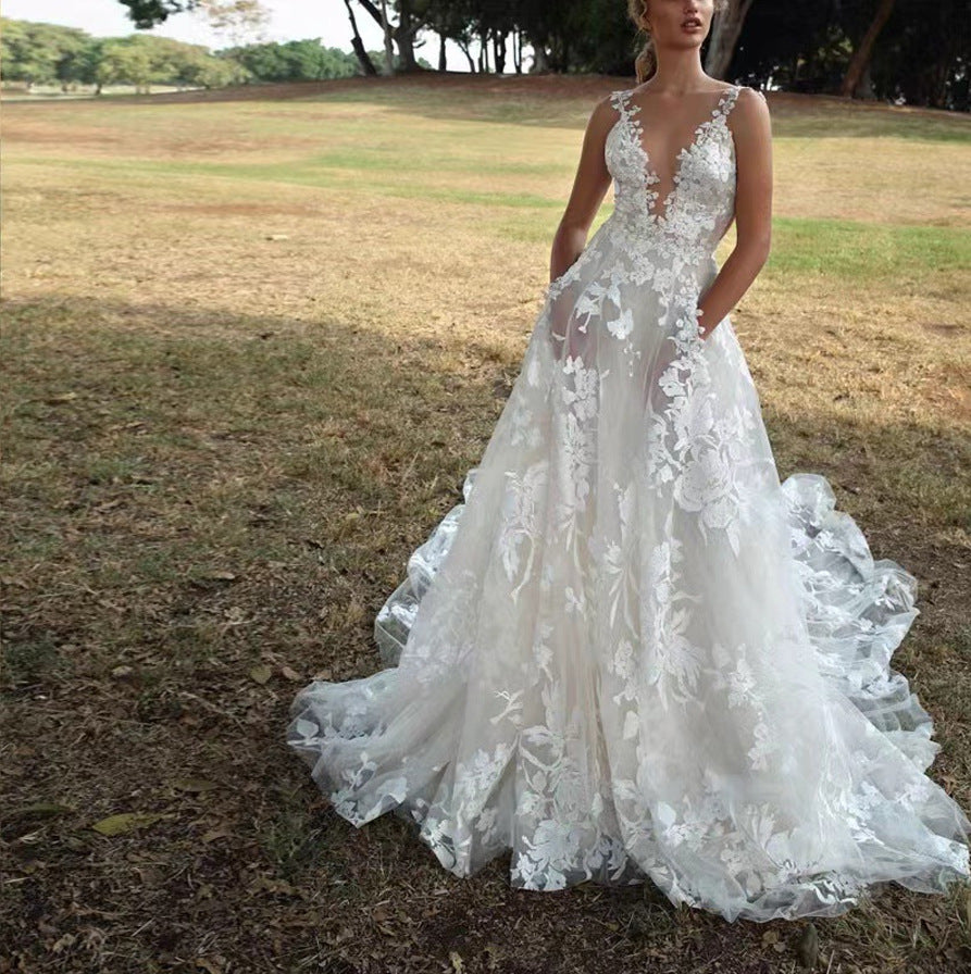 Women's V-Neck Sleeveless Lace Flowing Wedding Gown ¨C Elegant Bridal Dress