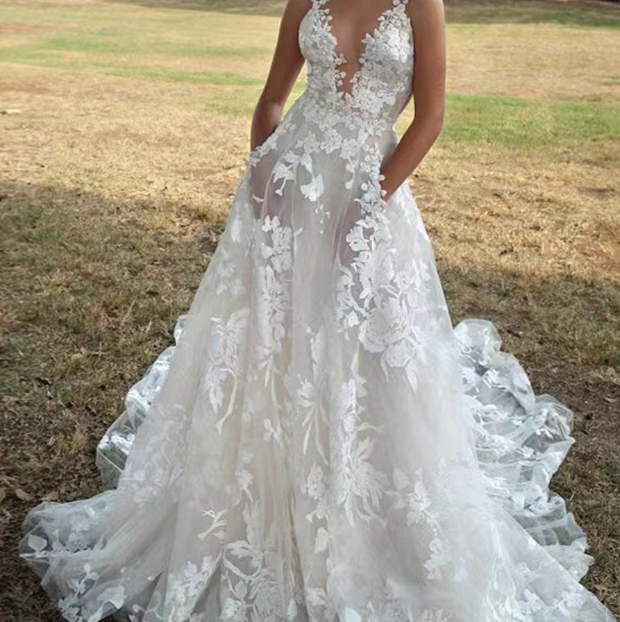 Women's V-Neck Sleeveless Lace Flowing Wedding Gown ¨C Elegant Bridal Dress