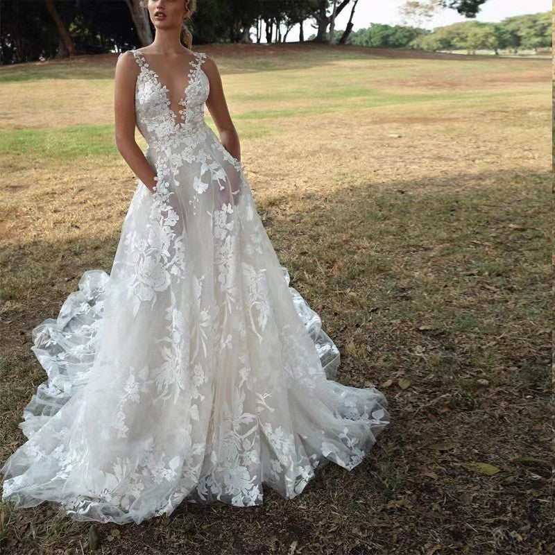 Women's V-Neck Sleeveless Lace Flowing Wedding Gown ¨C Elegant Bridal Dress