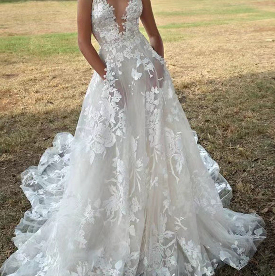 Women's V-Neck Sleeveless Lace Flowing Wedding Gown ¨C Elegant Bridal Dress
